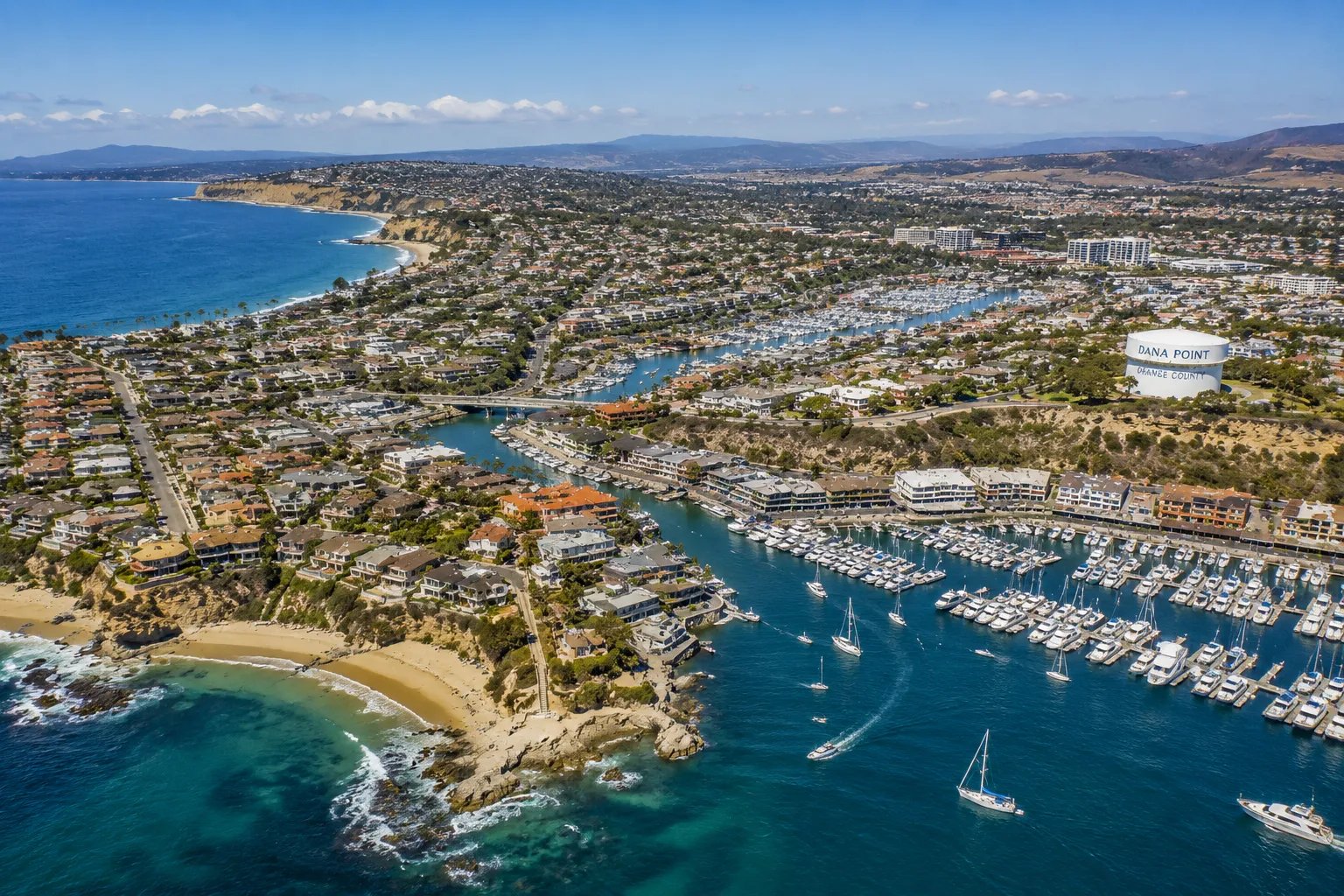 Aerial view of Dana Point harbor and the Orange County coastline, the coastal communities served by Vidro Art Storage